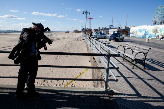 New York Daily News photographer Todd Maisel shooting a crime scene at Coney Island. 